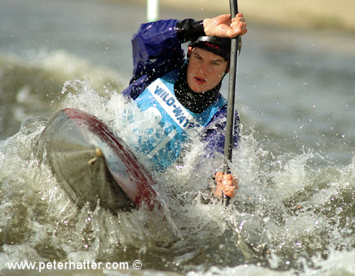 Sports photography example of white water canoe action.